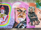 Lonnie Garner<br/>2022 - 2025<br/><span style= "font-size: 6pt">33.75187333208659, -84.36485896068052</span> Street Art Mural formerly in Cabbagetown Atlanta by Lonnie Garner featuring a woman biting outer space