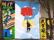 Xmaine (Jermaine Clark)<br/>2022 - 2023<br/><span style= "font-size: 6pt">33.75160856870622, -84.36602354337217</span> Street Art Mural formerly in Cabbagetown Atlanta by Xmaine (Jermaine Clark) featuring a person hanging from balloons