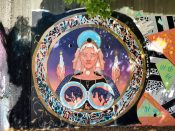 Gabeaux (Brittany Baum)<br/>2022 - 2024<br/><span style= "font-size: 6pt">33.75148465577748, -84.36657451093197</span> Street Art Mural formerly in Cabbagetown Atlanta by Gabeaux (Brittany Baum) featuring a woman looking at candles