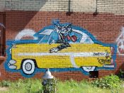 Artist ?<br/>2022 - 2025<br/><span style= "font-size: 6pt">33.744619603714476, -84.40155042649583</span> Street Art Mural formerly in Castleberry Hill Atlanta by an unknown artist featuring a yellow car