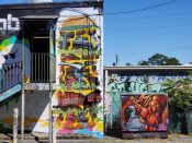 Jarrett Becke and Unoe<br/>2022 - 2023<br/><span style= "font-size: 6pt">33.76663894489484, -84.34965090250215</span> Street Art Murals formerly in Little Five Points Atlanta by Jarrett Becke and Unoe featuring a hamburger and an orange character