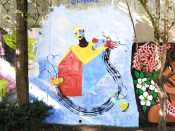 Melanie Paulos<br/>2022 - 2024<br/><span style= "font-size: 6pt">33.75183328449327, -84.36502240715448</span> Street Art Mural formerly in Cabbagetown Atlanta by Melanie Paulos featuring a house with a head sticking out