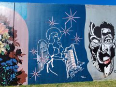 Street Art Mural formerly in Cabbagetown Atlanta by Maddy Barreto featuring an angel playing a piano