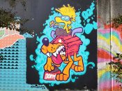 Doit Doit (Mario Daniel) and Oofster (Pierre Cerrato)<br/>2022 - 2023<br/><span style= "font-size: 6pt">33.75237757276133, -84.36284106309762</span> Street Art Mural by Mario Daniel and Pierre Cerrato featuring a bird on a dog house in Cabbagetown Atlanta