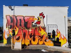 Street art mural formerly in Morningside-Lenox Park Atlanta by Letsgopaint (Matt Letrs) featuring a fire breathing chicken