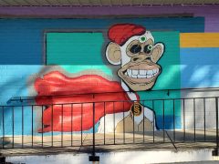Janice Wilcox<br/>2023 - 2626<br/><span style= "font-size: 6pt">33.85424514245511, -84.38133972281591</span> Street art mural formerly in Buckhead Atlanta by Janice Wilcox featuring a monkey.
