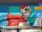 Janice Wilcox<br/>2023 - 2626<br/><span style= "font-size: 6pt">33.85424514245511, -84.38133972281591</span> Street art mural formerly in Buckhead Atlanta by Janice Wilcox featuring a monkey.