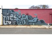 Peter Ferrari<br/>2012 - 2023<br/><span style= "font-size: 6pt">33.785385474899925, -84.42402867415117</span> Street Art Mural formerly in West Midtown Atlanta by Peter Ferrari featuring a grey tube pattern on a red background