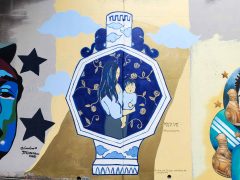 Street Art Mural formerly in Cabbagetown Atlanta by Nicole Kang Ahn featuring a vase with a mother and child