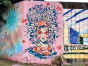 Angie Jerez<br/>2023 - 2025<br/><span style= "font-size: 6pt">33.75133259320794, -84.36661433950349</span> Street Art Mural in Cabbagetown Atlanta by Angie Jerez featuring a woman with plants on her head