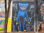 Will Mitchell<br/>2023 - 2024<br/><span style= "font-size: 6pt">33.75106760892906, -84.36743490922613</span> Street Art Mural formerly in Cabbagetown Atlanta by Will Mitchell featuring a blue creature