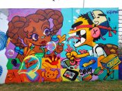 Drew Borders and Killamari<br/>2024 - 2025<br/><span style= "font-size: 6pt">33.752410154862986, -84.36272782457982</span> Street Art Mural in Cabbagetown Atlanta by Drew Borders and Killamari featuring a girl with french fries and a boy with worm