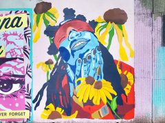 Street Art Mural formerly in Cabbagetown Atlanta by Erica Chisolm featuring a blue face and flowers