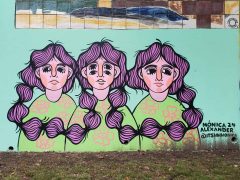 Street Art Mural formerly in Cabbagetown Atlanta by Monica Alexander featuring three women with connected hair