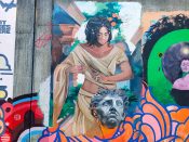 Trudy Tran and Nicole Merizalde<br/>2024 - 2025<br/><span style= "font-size: 6pt">33.75208531486498, -84.36397686249299</span> Street Art Mural formerly in Cabbagetown Atlanta by Trudy Tran and Nicole Merizalde featuring a woman carving a sculpture