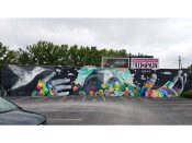 Dasic Fernandez<br/>2015 - 2024<br/><span style= "font-size: 6pt">33.77516738413695, -84.4068957632747</span> Street Art Mural formerly in West Midtown Atlanta by Dasic Fernandez featuring a person with rainbow gloves