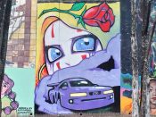 Will Mitchell<br/>2024 - 2025<br/><span style= "font-size: 6pt">33.75106760892906, -84.36743490922613</span> Street Art Mural formerly in Cabbagetown Atlanta by Will Mitchell featuring a car driving in front of a spooky face