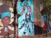 Lauren Pallotta Stumberg<br/>2016 - 2020<br/><span style= "font-size: 6pt">33.75212353055605, -84.36388249762172</span> Street Art Mural formerly in Cabbagetown Atlanta by Lauren Pallotta Stumberg featuring a woman wearing feathers