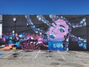 Arrrtaddict (Lisette Correa) and Letsgopaint (Matt Letrs) Letrs<br/>2024 - 2025<br/><span style= "font-size: 6pt">33.76338505428862, -84.3514194490328</span> Street Art Mural formerly in Little Five Points Atlanta by Arrrtaddict featuring a purple face. Graffiti by Letsgopaint (Matt Letrs)