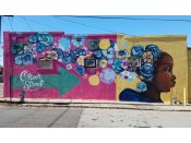 Eric Nine<br/>2019 - 2020<br/><span style= "font-size: 6pt">33.77321886912332, -84.41450454405633</span> Street Art Mural formerly in English Avenue Atlanta by Eric Nine featuring a face and flowers