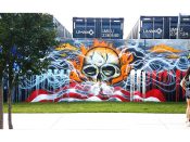 Michi Meko<br/>2018 - 2019<br/><span style= "font-size: 6pt">33.75250591407515, -84.3623413801802</span> Street Art Mural formerly in Cabbagetown Atlanta by Michi Meko featuring a skull on a red white and blue background