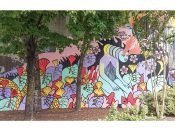 Erin Bassett<br/>2018 - 2020<br/><span style= "font-size: 6pt">33.75228645859033, -84.3632285960455</span> Street Art Mural formerly in Cabbagetown Atlanta by Erin Bassett featuring hands holding leaves and a woman with many faces.