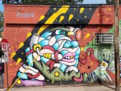 Denton Burrows<br/>2016 - 2021<br/><span style= "font-size: 6pt">33.73896516523123, -84.36799680772383</span> street art mural formerly in Grant Park Atlanta by Denton Burrows featuring a multi-colored face