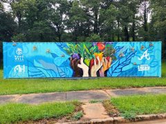 Charity Hamidullah<br/>2025 - <br/><span style= "font-size: 6pt">33.6892537185935, -84.35355434841343</span> Street Art Mural in Southeast Atlanta by Charity Hamidullah featuring hands holding vegetables