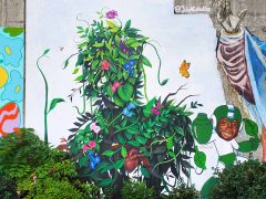 Julio Ceballos and Ashley Anderson<br/>2024 - <br/><span style= "font-size: 6pt">33.75200601204792, -84.3643372195595</span> Street Art Mural in Cabbagetown Atlanta by Julio Ceballos and Ashley Anderson featuring plants and a man in green