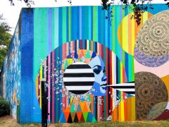 Lela Brunet<br/>2025 - <br/><span style= "font-size: 6pt">33.75233133701918, -84.3630317433235</span> Street Art Mural in Cabbagetown Atlanta b Lela Brunet featuring a woman with an blue face on a striped background