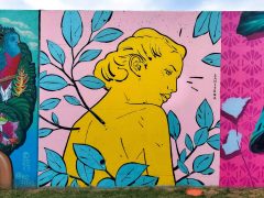 Street Art Mural formerly in Cabbagetown Atlanta by Sanithna Phansavanh featuring a woman in yellow