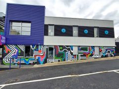 Artist ?<br/>2025 - <br/><span style= "font-size: 6pt">Location</span> Street art Mural in Decatur Georgia by an unknown artist featuring an abstract pattern