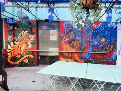 Dosa Kim<br/>2025 - <br/><span style= "font-size: 6pt">33.740406742121536, -84.34629342003679</span> Street Art Mural in East Atlanta Village by Dosa Kim featuring a tiger and a lion