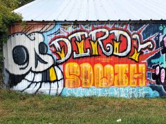 Smilin Death (Geoffrey Solomon)<br/>2025 - <br/><span style= "font-size: 6pt">33.734818595360984, -84.40526222425056</span> Street Art Mural in Pittsburgh Atlanta by Smilin Death (Geoffrey Solomon) featuring "dirty south"