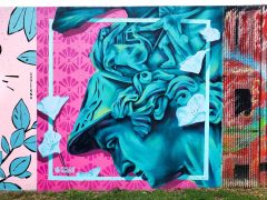 Street Art Mural formerly in Cabbagetown Atlanta by Nicole Merizalde featuring the Greek god Mercury