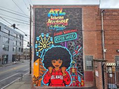 George F. Baker III and Roc Sol<br/>2026 - <br/><span style= "font-size: 6pt">33.754408530545895, -84.37162000306796</span> Street Art Mural in Old Fourth Ward Atlanta by George F. Baker III and Roc Sol featuring a woman in a red hoody