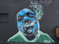 Enoch Waters<br/>2026 - <br/><span style= "font-size: 6pt">33.795041947026974, -84.26358998341375</span> Street Art Mural in Greater Valley Brook, Georgia by Enoch Waters featuring a blue man smoking