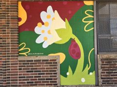 Leah Kellaway<br/>2026 - <br/><span style= "font-size: 6pt">33.75082308849971, -84.39958396275736</span> Street Art Mural in Castleberry Hill Atlanta by Leah Kellaway featuring a flower and a ladybug