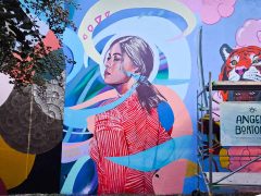 Street Art Mural in Cabbagetown Atlanta by Angela Bortone featuring a woman in red