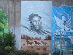 Street Art Mural in Cabbagetown Atlanta by Emily Cadena featuring a face and a western scene