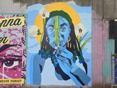 Street Art Mural in Cabbagetown Atlanta by Erica Chisolm featuring a woman holding a leaf