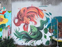 Street Art Mural in Cabbagetown Atlanta by Julio Ceballos featuring two goldfishes