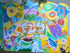 Street Art Mural in Cabbagetown Atlanta by Kevin Bongang featuring "fly"and an abstract pattern