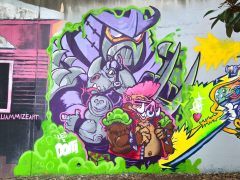 Street Art Mural in Cabbagetown Atlanta by Doit Doit (Mario Daniel) featuring three characters