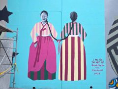 Street Art Mural in Cabbagetown Atlanta by Nicole Kang Ahn featuring two women connected by their hair