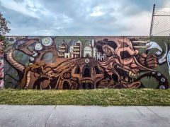 Street Art Mural in Cabbagetown Atlanta by Wombat Fire featuring fantasy architecture