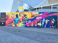 Street Art Mural in Downtown Atlanta by Trudy Tran featuring soccer players