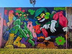 Street Art Mural in Cabbagetown Atlanta by Drew Borders and Killamari featuring two characters