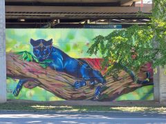 Street Art Mural in Edgewood Atlanta by Trudy Tran and Krispyaki (Aki Tran) featuring a panther wearing jewelry